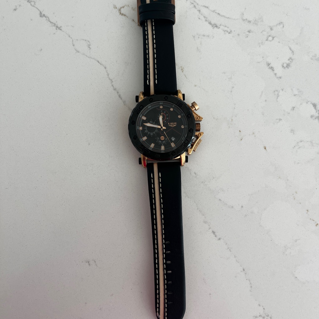 Black And Gold Watch With Leather Strap